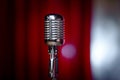 Retro microphone and red curtain Royalty Free Stock Photo