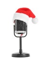 Retro microphone with Santa hat on white. Christmas music concept