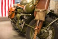 Retro military American motorcycle of protective color at the ex