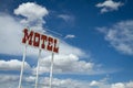 Retro Motel Sign and Clouds Royalty Free Stock Photo