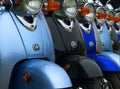 Retro motor scooters lined up in a row