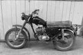 Retro motorcycle. Black and white photo. Old vintage card. Royalty Free Stock Photo