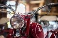 Retro motorcycle with headlight on blurred background Royalty Free Stock Photo