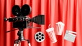 retro movie camera decoration with popcorn,reel film,clapper board,drink mug Royalty Free Stock Photo