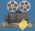 Retro movie projector with film reel and tickets. Analog device cinema motion picture film projector Royalty Free Stock Photo