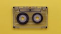 Retro music compact cassette reeling tape as if playing