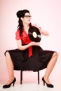 Retro music. Pinup girl with vinyl record Royalty Free Stock Photo