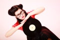 Retro music. Pinup girl with vinyl record Royalty Free Stock Photo