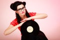 Retro music. Pinup girl with vinyl record Royalty Free Stock Photo