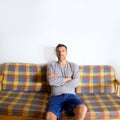 Retro mustache man sitting in vintage sofa Royalty Free Stock Photo