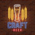 Retro neon Beer Bar sign on brick wall background.