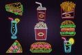 Retro neon burger, cola, popcorn, french fries and fast food sign on brick wall background. Design for cafe Vector. Neon Royalty Free Stock Photo