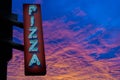 Retro Neon Pizza Sign At Sunset