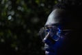 Retro neon portrait of an African American. Black man with modern glasses Royalty Free Stock Photo