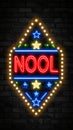 Retro neon sign with NOOL text and star lights against dark brick wall Royalty Free Stock Photo