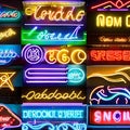 1134 Retro Neon Signs: A retro and vintage-inspired background featuring retro neon signs with glowing lights, retro typography,