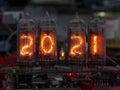 Retro Nixie lamp indicator clock on dark background 2021 number