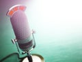 Retro old microphone with text on the air. Radio show or audio p Royalty Free Stock Photo