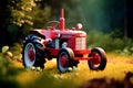 Retro old tractor massy red color, green environment Royalty Free Stock Photo