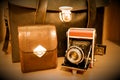 Retro old vintage outdated manual film camera circa 1940s, leather carrying case coffer for the camera accessories and camera case Royalty Free Stock Photo