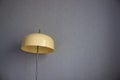 Retro oviform lamp on blue wall background Royalty Free Stock Photo