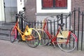 Retro painted students bikes along canal houses, Leiden, Netherlands Royalty Free Stock Photo