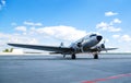 Retro passenger plane on the runway. sunny summer day with clouds Royalty Free Stock Photo