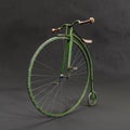 Retro Penny-farthing bicycle against black background Royalty Free Stock Photo