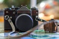 Retro photo camera, film and old photos on the table Royalty Free Stock Photo