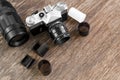 Retro photo camera on a wooden table.