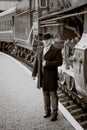 Retro photo of elegant man waiting on platform for train Royalty Free Stock Photo