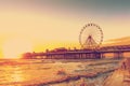 RETRO PHOTO FILTER EFFECT: Blackpool Central Pier at Sunset with Ferris Wheel, Lancashire, England UK