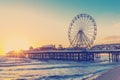 RETRO PHOTO FILTER EFFECT: Blackpool Central Pier at Sunset with Ferris Wheel, Lancashire, England UK Royalty Free Stock Photo