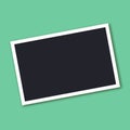 Retro photo frame with shadow isolated on green background. Royalty Free Stock Photo