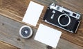 Retro photo mock up, vintage camera and lens on old wooden backg Royalty Free Stock Photo