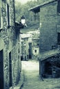 Retro photo of narrow street of old Catalan village