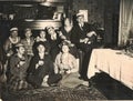 The retro photo shows a group of happy people celebrate a social event - birthday party...Golden the thirties before the war Royalty Free Stock Photo