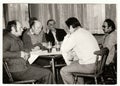 Retro photo shows men in the pub - inn. Vintage black and white photography.