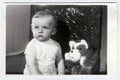 Retro photo of a small boy with teddy bear. Portrait photo was taken in photo studio, circa 1972