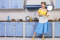 Retro pin up girl housewife in the kitchen