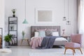 Pink chair in adorable bedroom