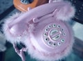 Retro pink desk telephone with plush Royalty Free Stock Photo