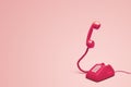 Retro pink telephone on retro pink background Royalty Free Stock Photo