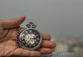 A retro pocket watch with chain in the palm of the girl`s hand Royalty Free Stock Photo