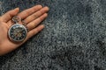 A retro pocket watch with chain in the palm of the girl`s hand Royalty Free Stock Photo