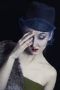 Retro portrait of a beautiful young woman in hat with veil Royalty Free Stock Photo