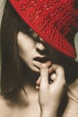 Retro portrait of seductive adult woman with red hat