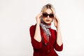 Retro portrait sexy young woman with beautiful lips in fashionable leopard scarf on head in stylish sunglasses in red elegant