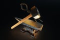 Retro profession concept, blacksmith, hard work, strength. Metal heavy anvil and hammer isolated on a dark background. 3D