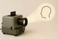 A retro projector that creates a projection of the head with a spiral inside. Royalty Free Stock Photo